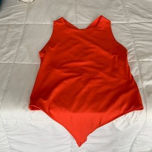 Bright orange express body contour cross back thong body suit
